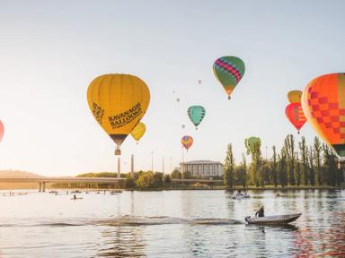 Wake up to a view of hot air balloons floating across the city during the Canberra Balloon Spectacular. Held over nine d...