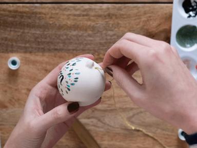 Get into the festive spirit with our online Hand Painted Christmas Bauble workshop!You'll first set up a mini paint station at home or in the office using the ceramic bauble and paint kits provided.You'll be taught the basic techniques of brush lettering- allowing you to personalise your own ceramic baubles- and how to paint delicate Christmas symbols to frame your message.Then you'll be invited to channel your own creativity as you each design and develop your very own Christmas illustrations using a variety of inspiring imagery and props- with on hand help from leading artist Sarah Rowan.As one of Australia's top live performance artists - Sarah will inspire you with stories of creativity and imagination along the way and you'll leave the class with beautiful additions to your Christmas tree or great gifts to share with friends and family.We'll send you a Zoom link and passcode to share with your invitees before your session time that's a simple click and connect. If you suffer a technical glitch our event gurus will be on hand to help.Kits available for delivery Australia-wide.