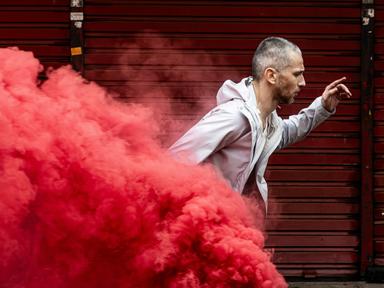 A street. Action! The scene begins: a truck rumbles by, music blaring. A dancer sprints, leaps, stumbles - and suddenly,...