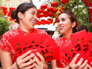 During Lunar New Year- the gift of a red envelope from family or friends is a traditional symbol of prosperity and good ...