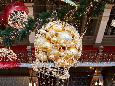 In an aesthetic ode to the beauty of the Australian landscape- the Strand Arcade is adorned in a specially commissioned installation of Christmas decorations inspired by native flowers.The beautiful- oversized- blossoming eucalyptus branches float from the ornate ceiling.&nbsp;Each branch stands at an impressive 3.5 metres tall- 9.8 metres long and vertically spans multiple levels of the arcade.The hanging installations feature a combined count of 10 acrylic green leaves- 6 red budding flowers and whimsical golden gumnuts that are brought to life with cascading lights.The installation will be illuminated throughout the holiday season with the help of more than 3-500 individual twinkling Christmas lights that cover each of the ornaments from tip to toe.These speculator sculptures celebrate the Strand Arcade's steep Australian history- through utilising inspiration from native flora and fauna artfully blended with beautiful modernity.Join us now and see them in person at the Strand Arcade.