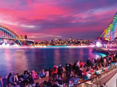 Experience Vivid Sydney and see the city's iconic landmarks be bathed in light and sound from the water aboard Tribal Wa...